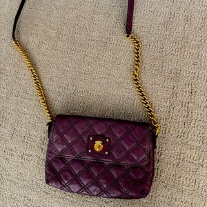 Marc Jacob’s purple shoulder bag with zipper compartment and 8 card slots